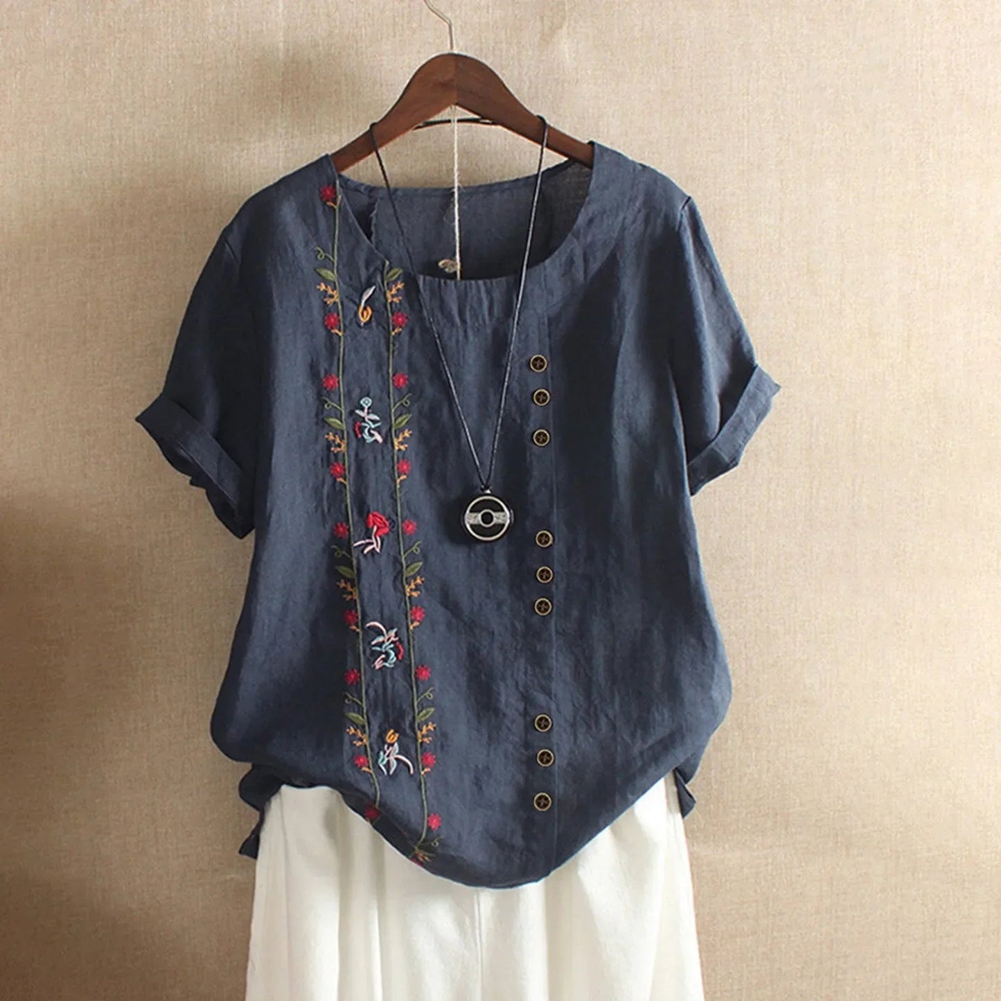 Löst sittande kortärmad blus med rund hals för kvinnor