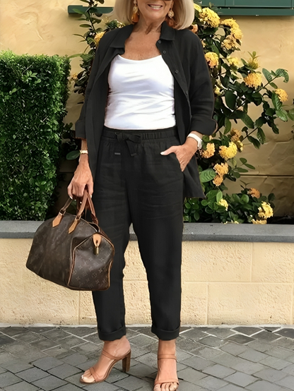 Fashionabel knappar blus och byxor för kvinnor