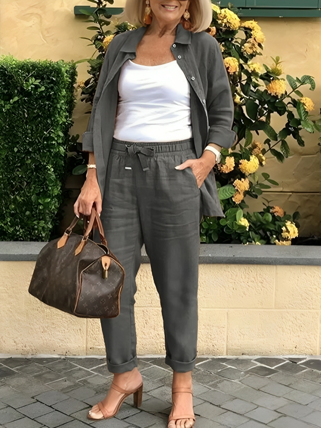 Fashionabel knappar blus och byxor för kvinnor