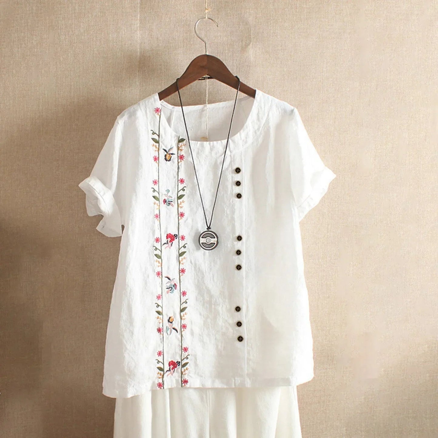 Löst sittande kortärmad blus med rund hals för kvinnor