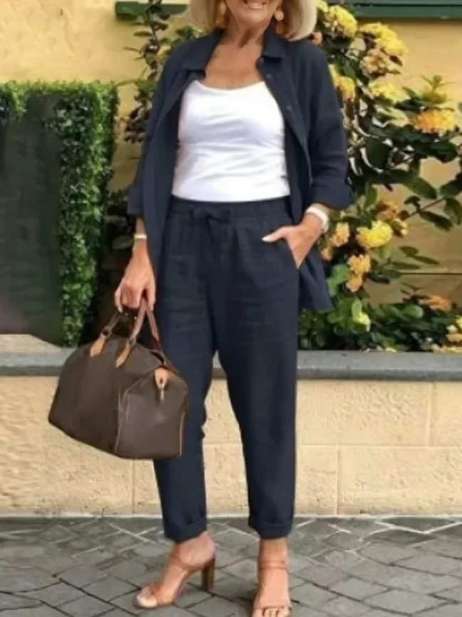 Fashionabel knappar blus och byxor för kvinnor