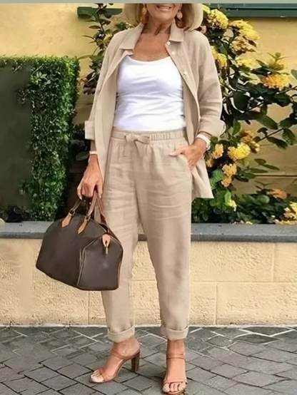 Fashionabel knappar blus och byxor för kvinnor