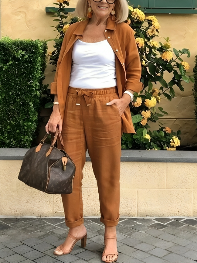 Fashionabel knappar blus och byxor för kvinnor